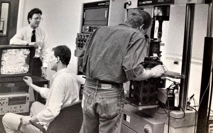 Early in-situ research of fracture behavior in advanced composites on an Instron 1361 electromechanical testing machine capable of test rates as slow as the rate of fingernail growth. Pictured are then Assistant Professor John J. Lewandowski (standing, le