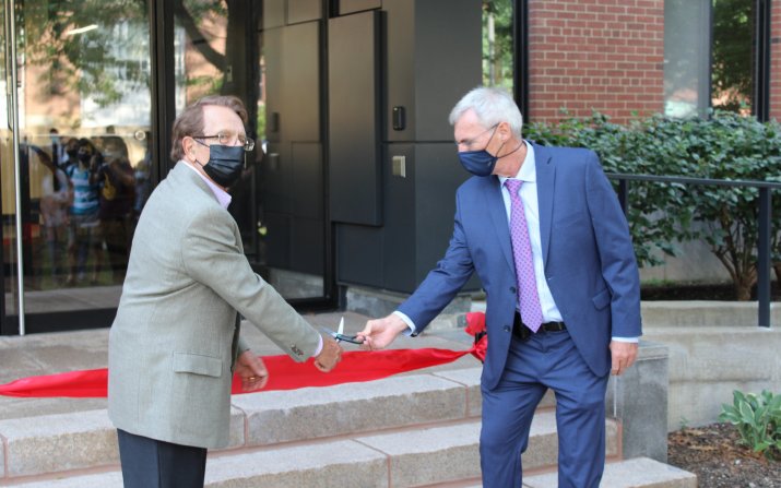Robert Smialek and Frank Ernst cut the ribbon to reopen White Building