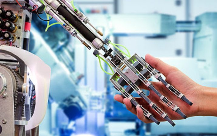 Image of robotic hand and human hand