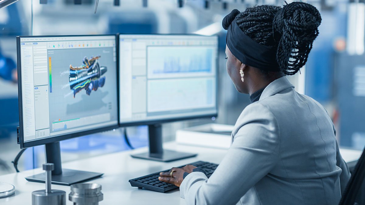 Female Engineering Mechanics student working on a 3D computer model in a lab