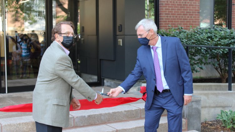 Robert Smialek and Frank Ernst cut the ribbon to reopen White Building