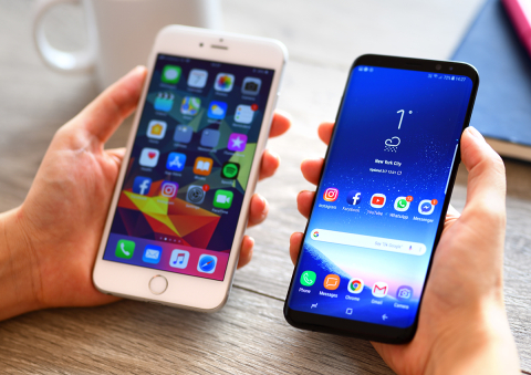 two smartphones held side by side