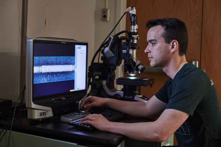 Engineer using the Keyence VHX 5000 Microscope