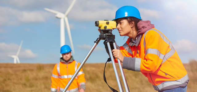 Female environmental engineering student working with a faculty member in the field