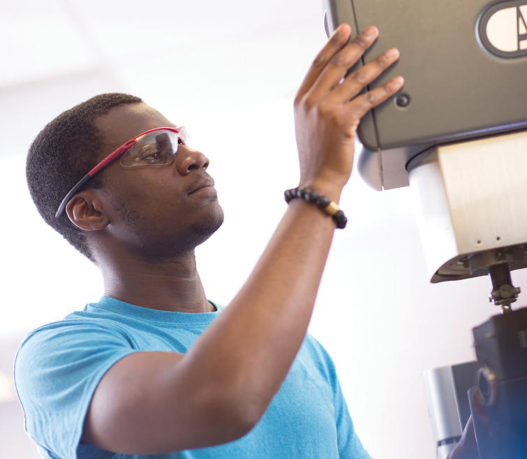 macromolecular science and engineering student working in lab