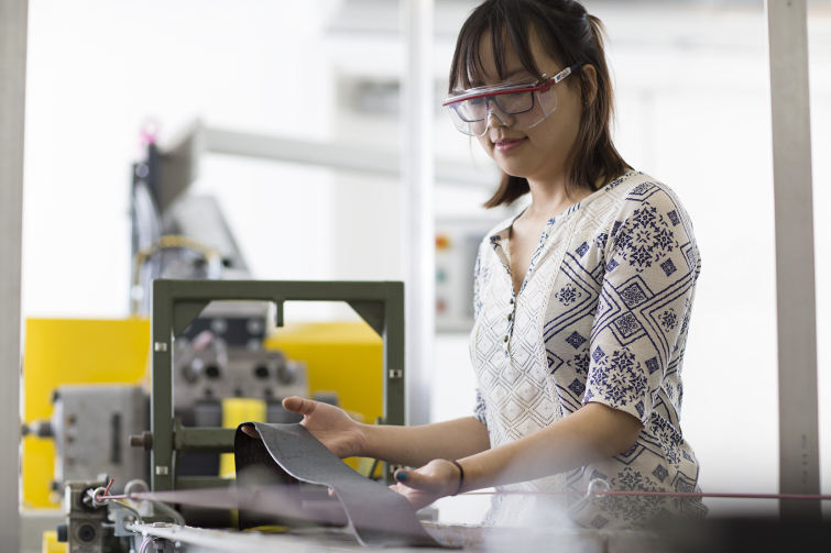 Student researcher working with rubber