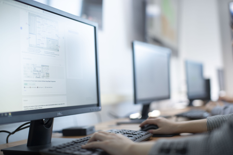 A row of classroom desktops being used by Case Western Reserve University students