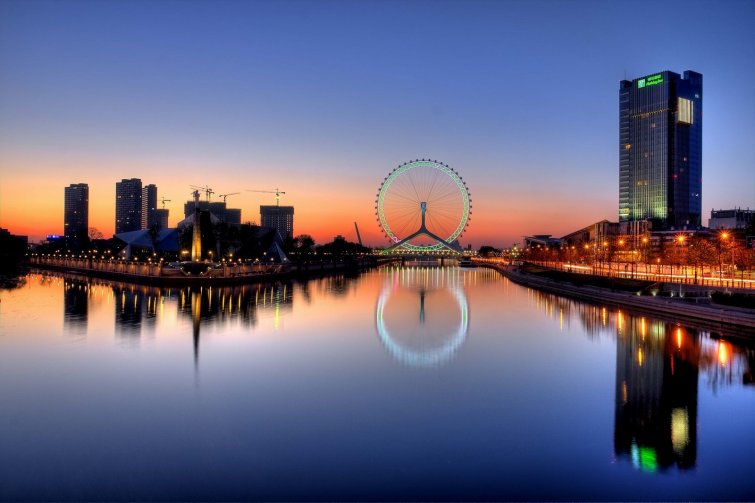 skyline view of the city of Tianjin in China at sunset