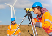 Female environmental engineering student working with a faculty member in the field