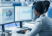 Female Engineering Mechanics student working on a 3D computer model in a lab