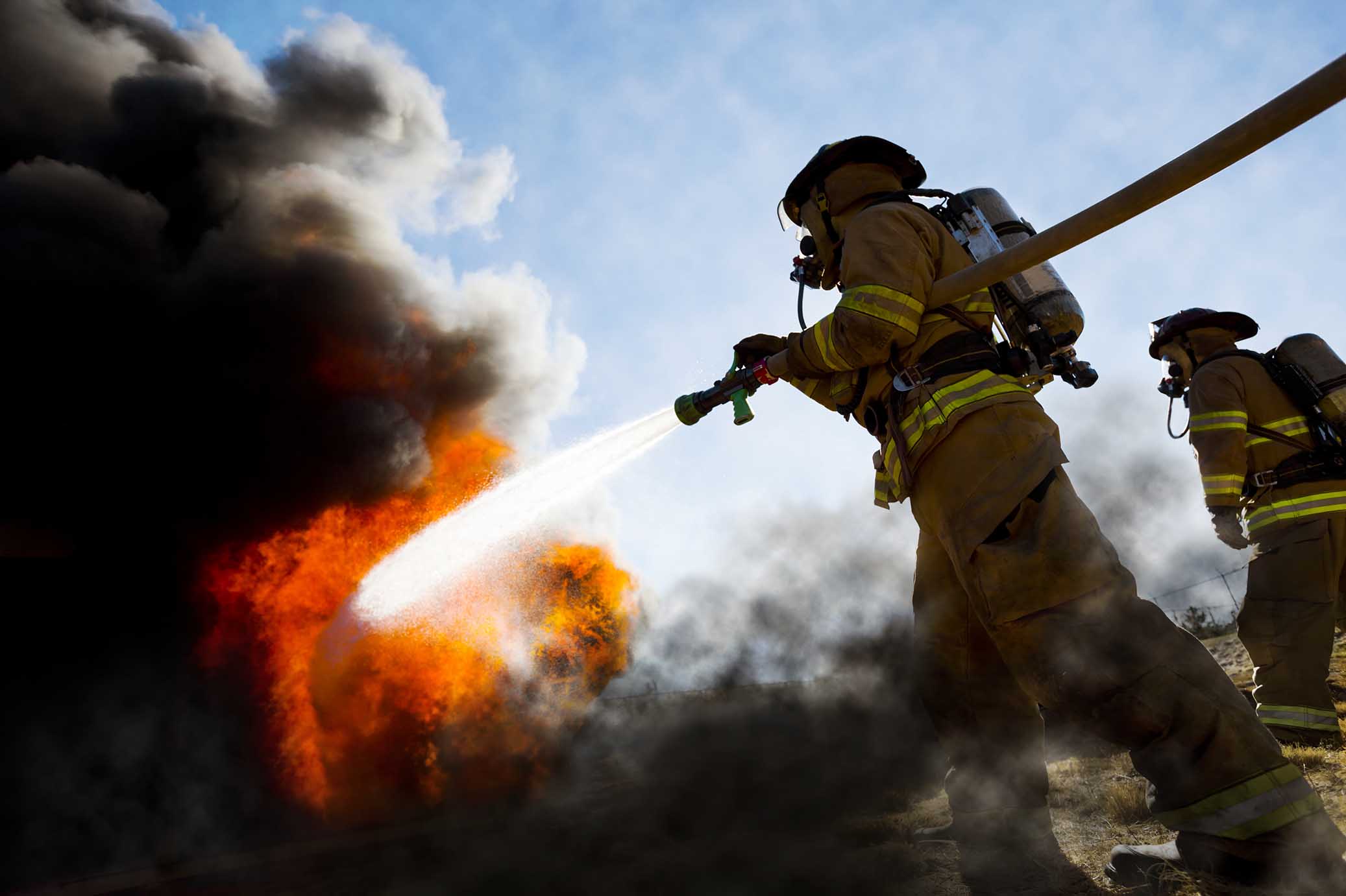 Firefighter putting out fire